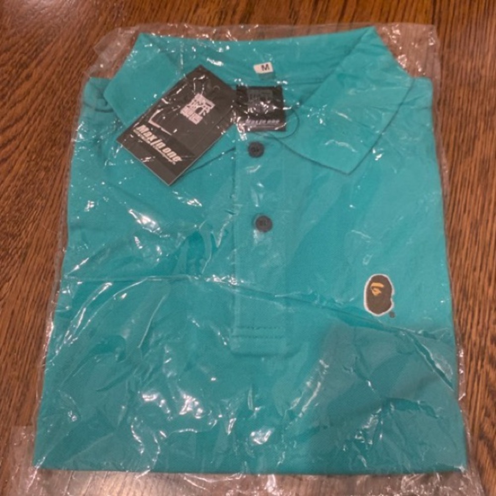 NEW in package with tags Bape teal polo size Med.